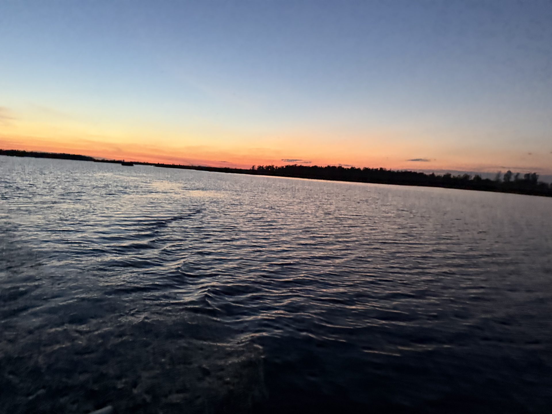 Sunset over open marsh water